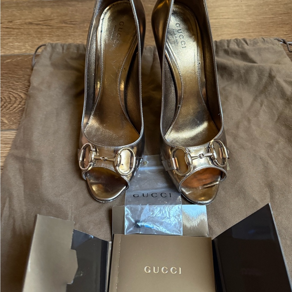 Gucci gold shoes with horse bit hardware
